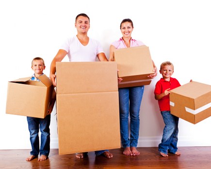 Small removals team handling boxes in Hoxton