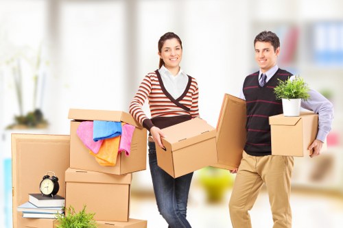Flat removals team preparing boxes in a Hoxton apartment